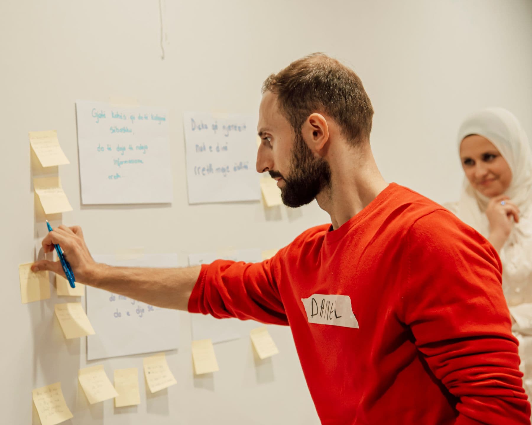 A team planning together around notes and charts.